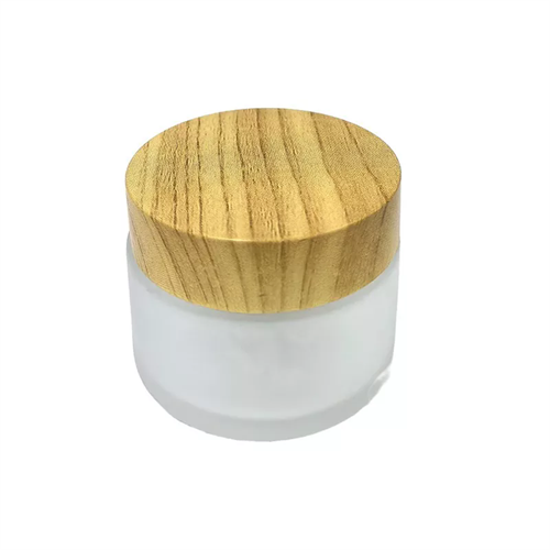 Cosmetisch lege glazen lotionpot met houten deksel